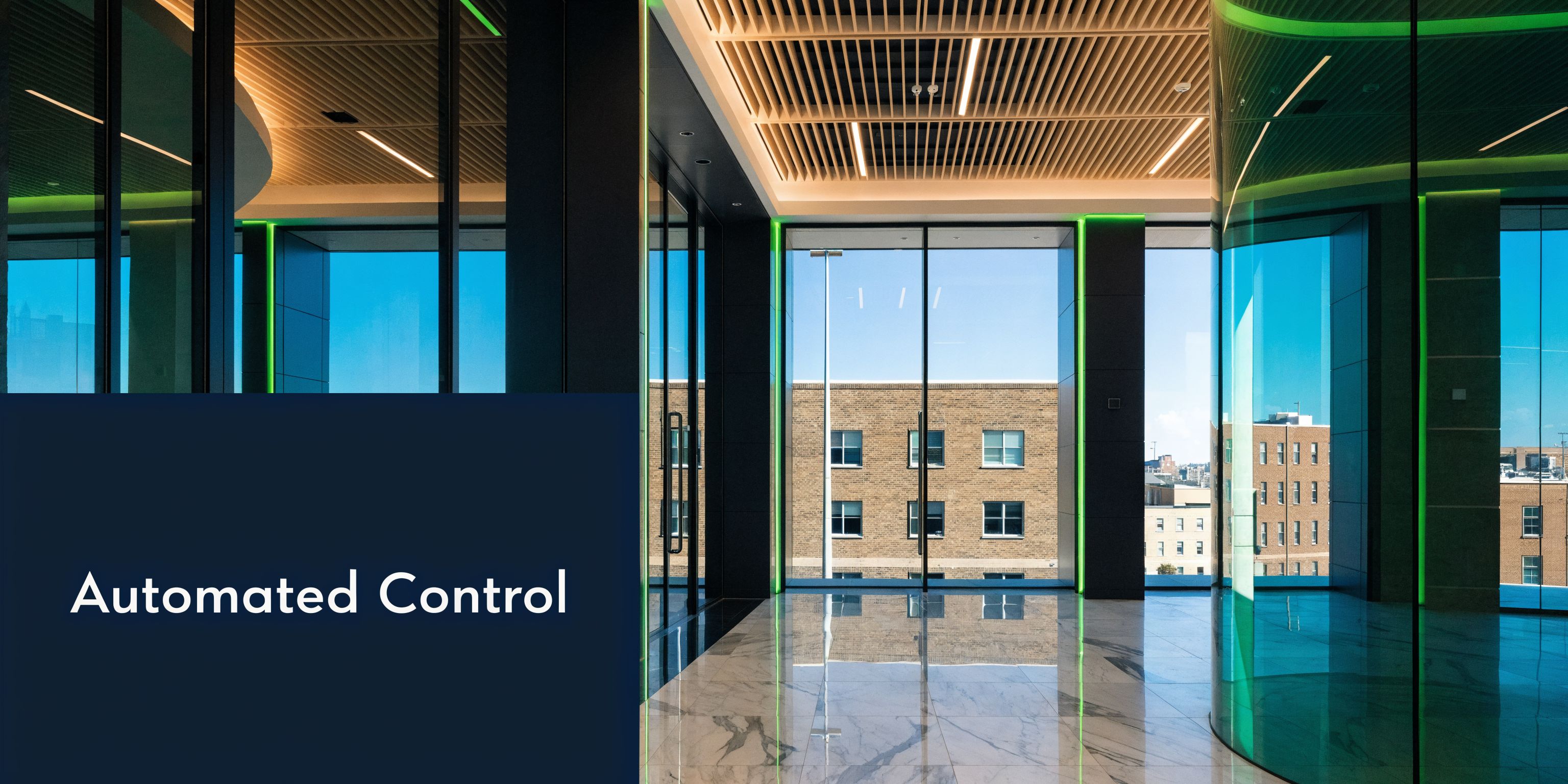 A sleek modern office interior with marble floors, glass walls, and a view of brick buildings.