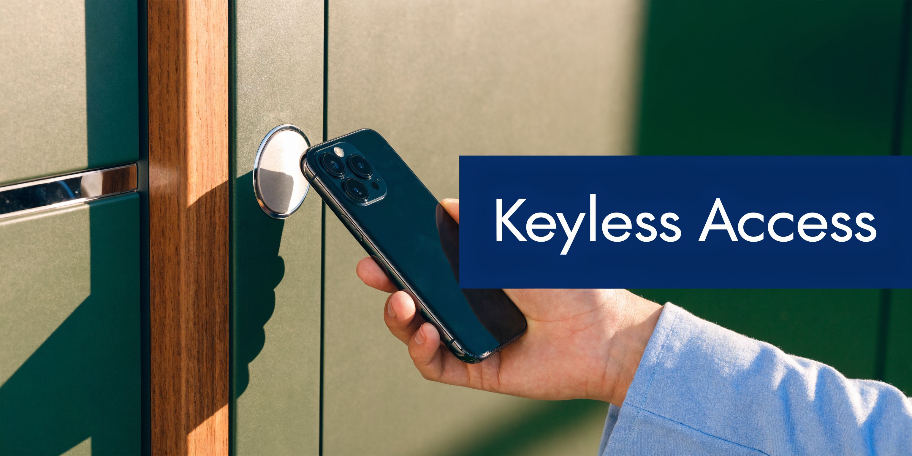 A person using their smartphone to unlock a modern door system via wireless keyless entry technology.
