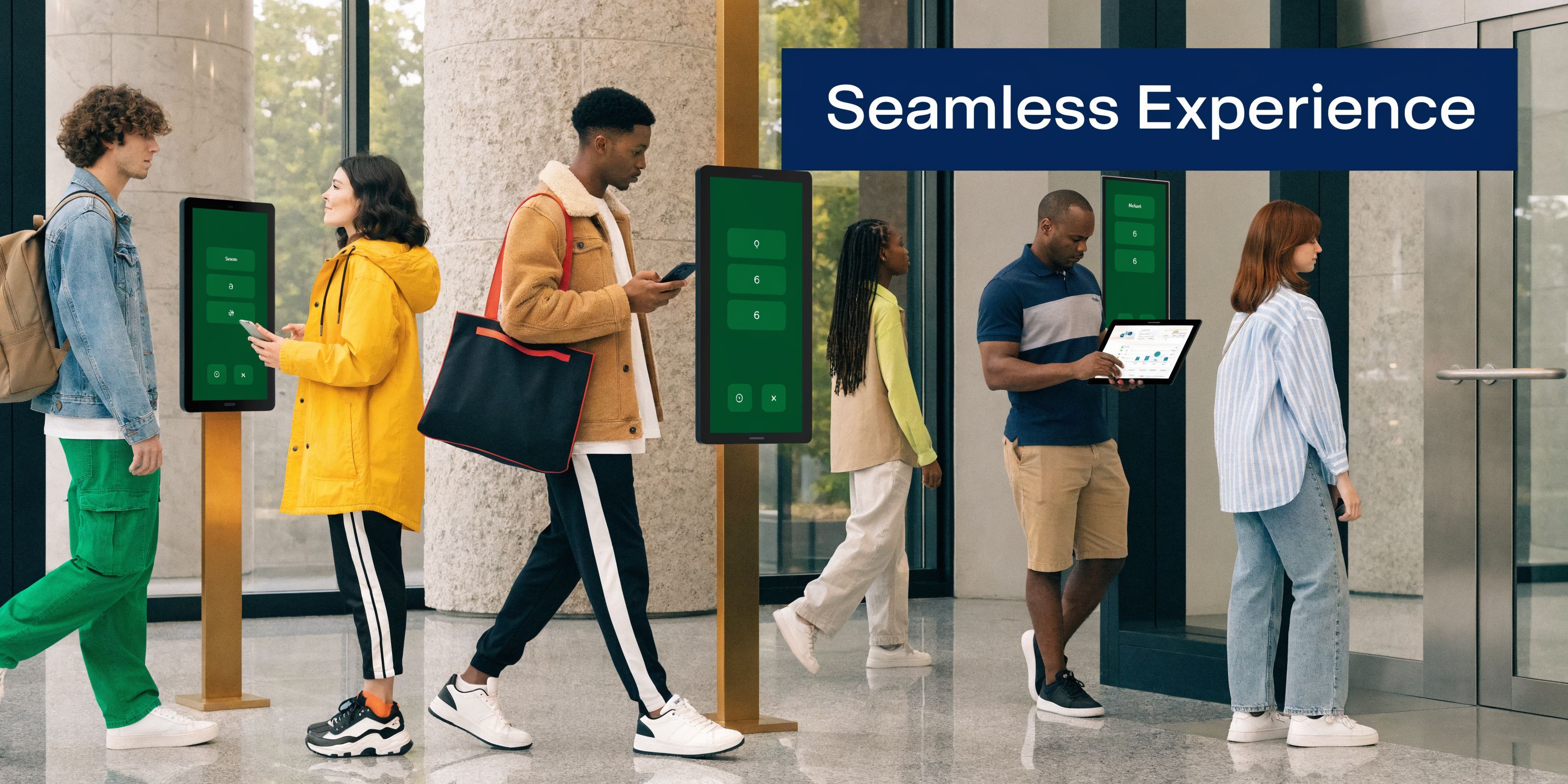 A diverse group of people interacting with digital kiosks and mobile devices in a modern office lobby.